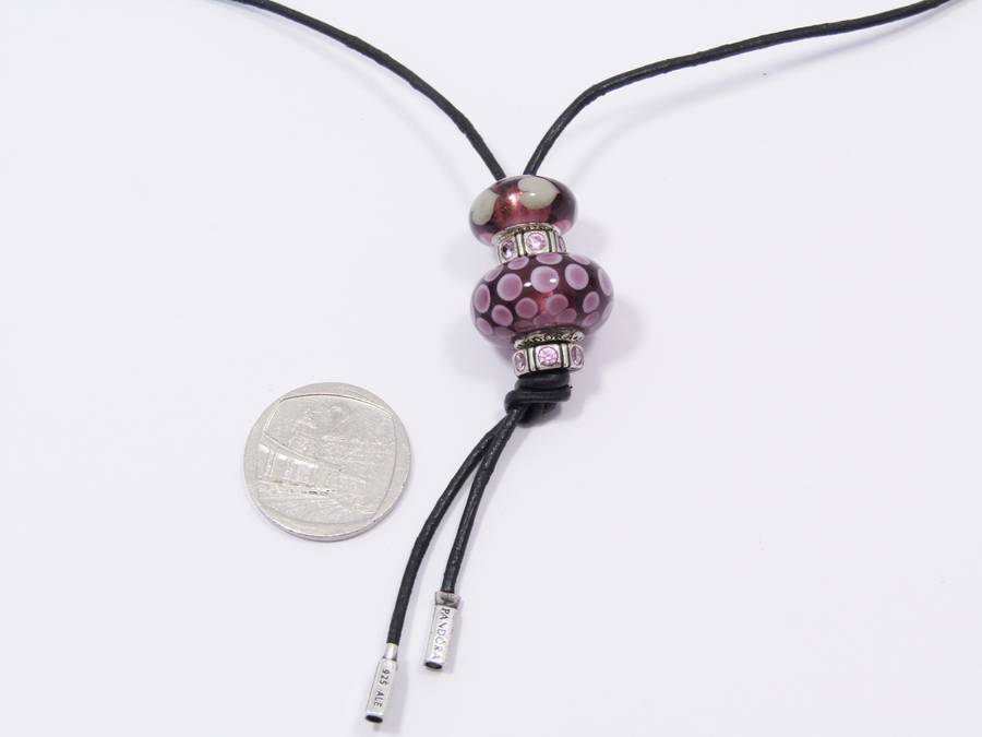 An Early Pandora Sterling Silver & Leather Fob
