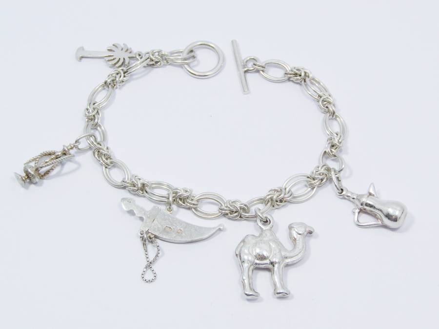 A Lovely Weighty Bracelet With Charms in Sterling Silver.