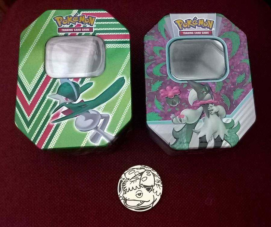 2x Empty Pokemon Tins and plastic coin