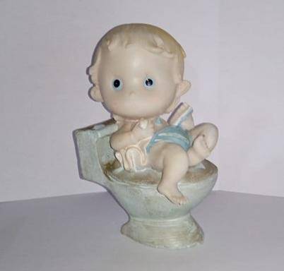 Boy on toilet figurine