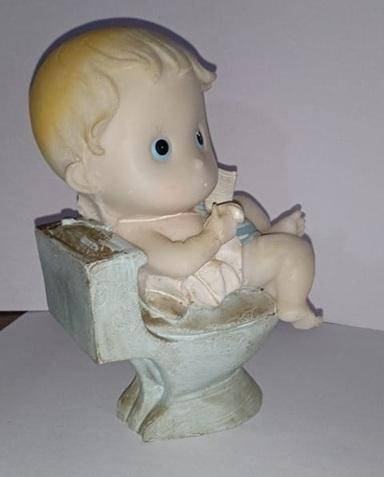 Boy on toilet figurine
