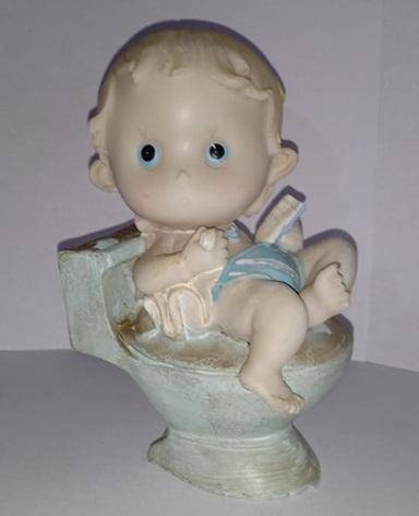 Boy on toilet figurine