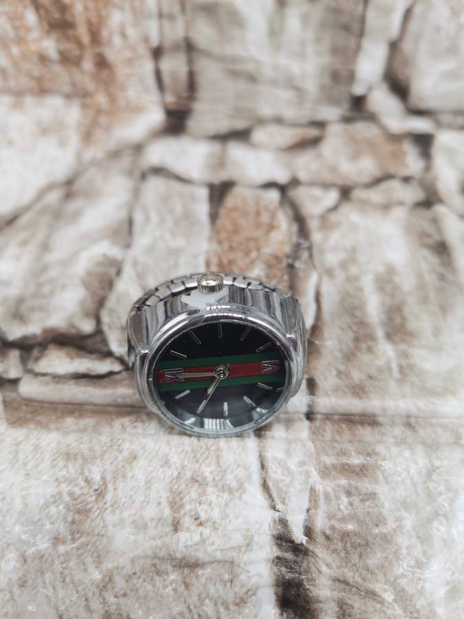 NEW TREND ---FINGER WATCH WITH STRECH BAND--ONE SIZE FITS ALL SILVER COLOR-BLACK FACE