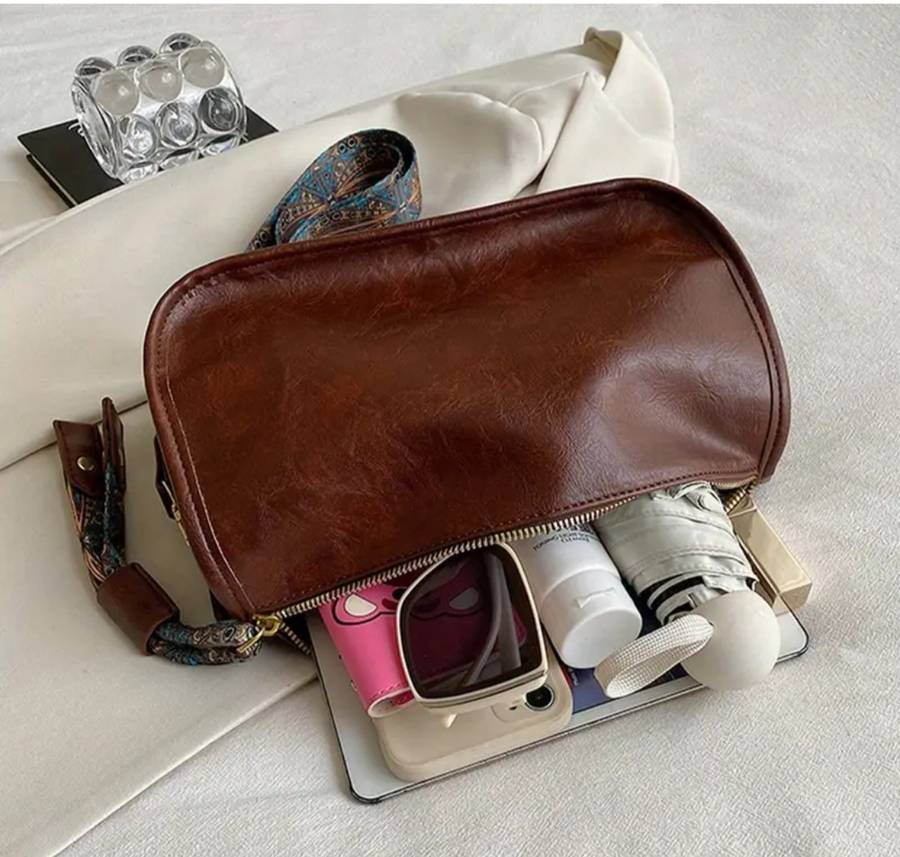 Black woman's shoulder sling handbag