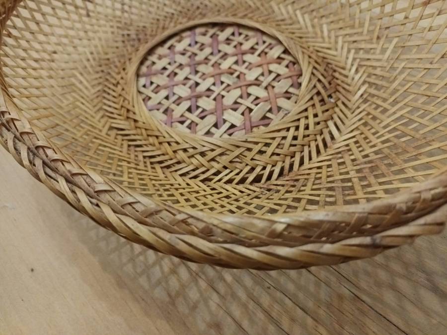 Small elliptical vintage wicker basket