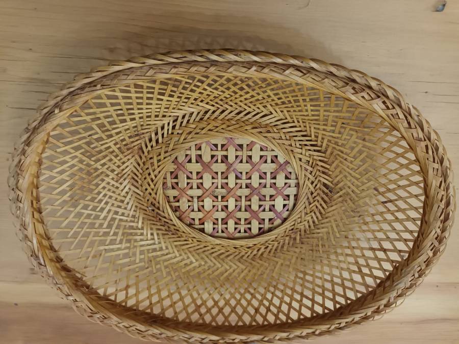 Small elliptical vintage wicker basket