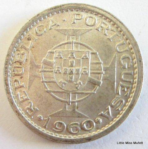 A 1960 Silver 5 Escudo Mozambique--CompositionSilver (.650) Weight4 g--Excellent coin