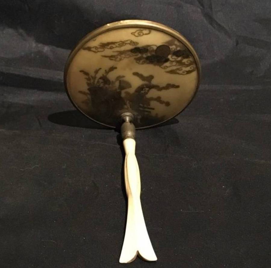 Vintage hand held mirror with moveable handle