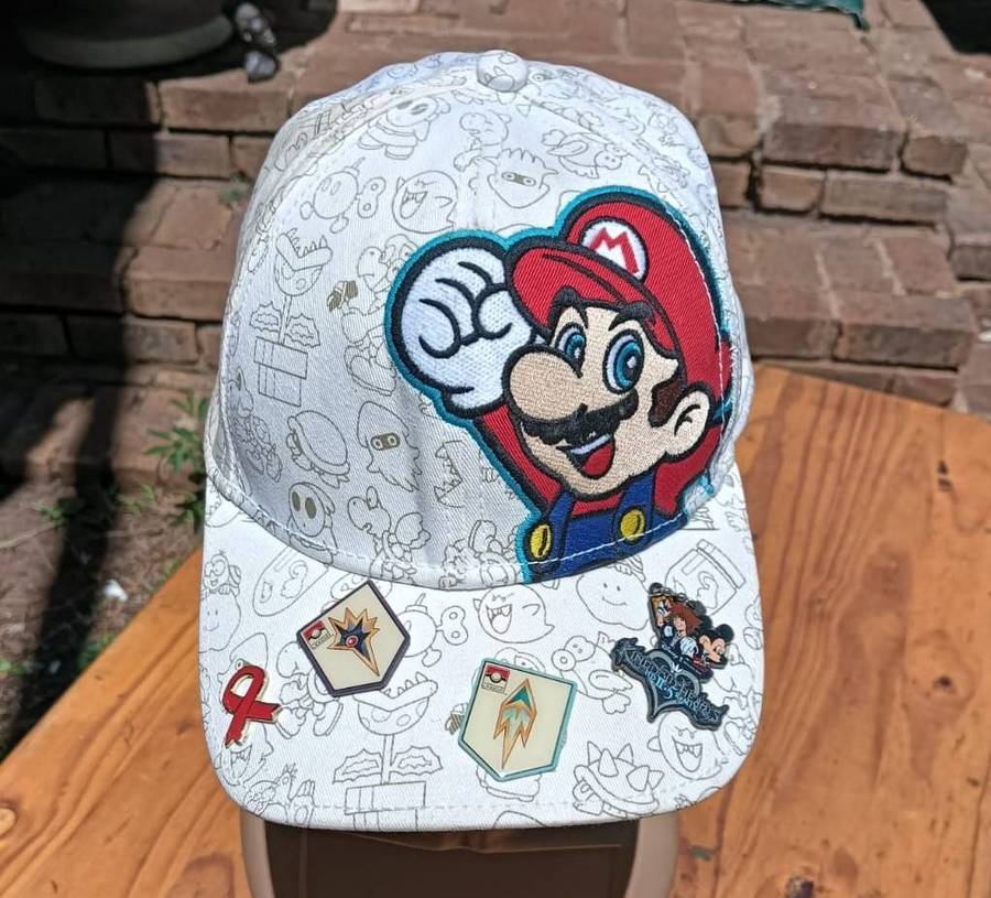 Super Mario Brothers Nintendo 2012 Snapback Cap with 2 pinned Pokemon League Gym Badges