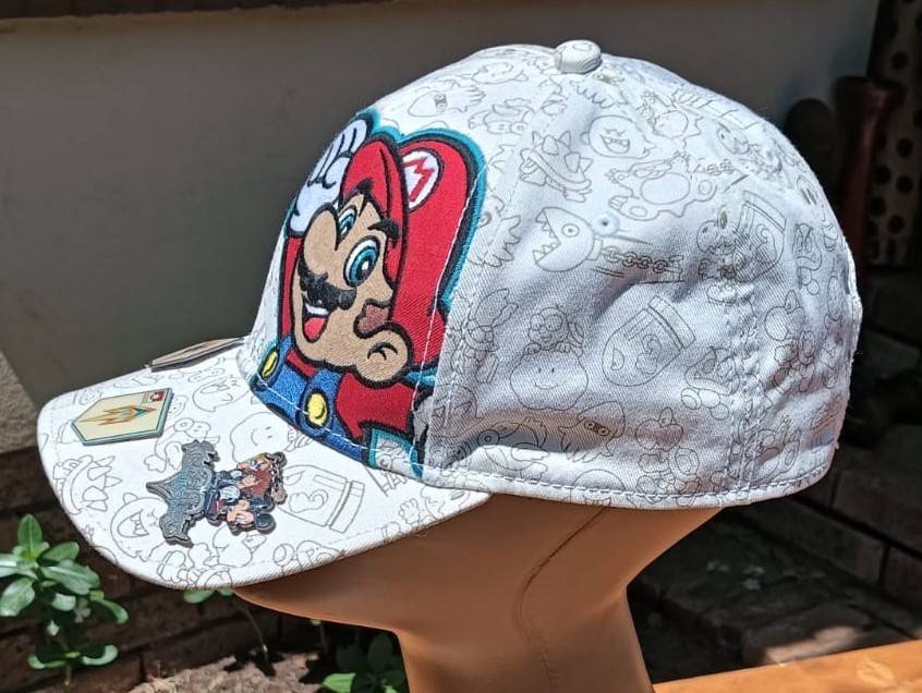 Super Mario Brothers Nintendo 2012 Snapback Cap with 2 pinned Pokemon League Gym Badges