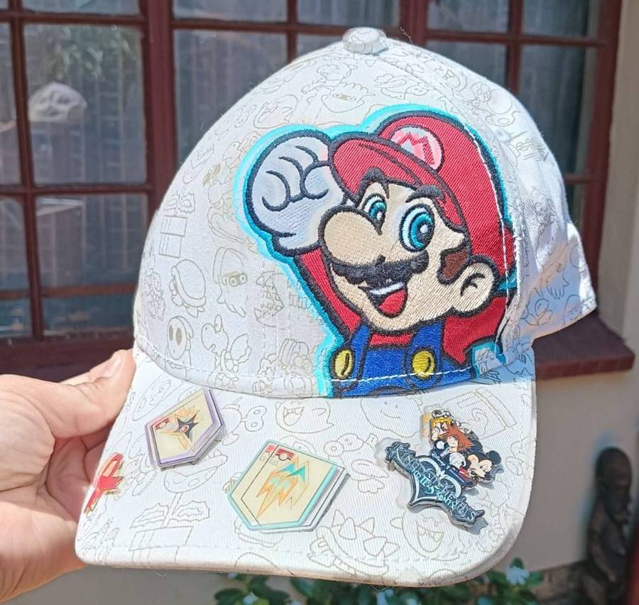 Super Mario Brothers Nintendo 2012 Snapback Cap with 2 pinned Pokemon League Gym Badges