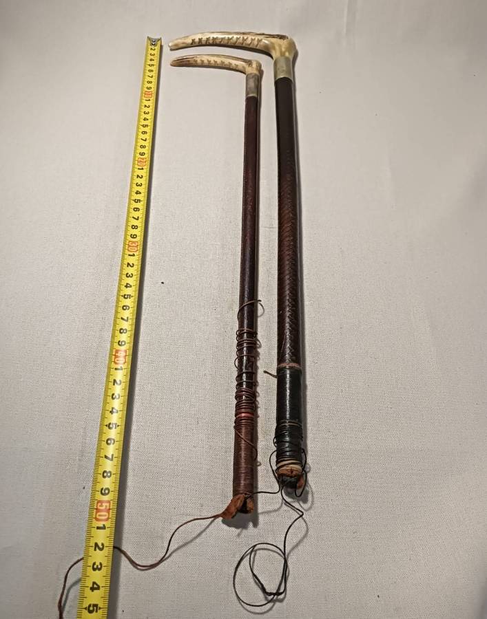 Two Antique Leather and Bone Handle Hunting Crops one with a Gloria Kerschot Silver Metal Collar