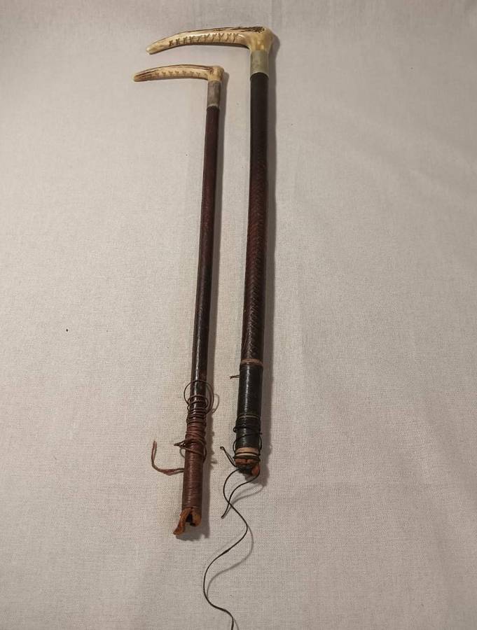Two Antique Leather and Bone Handle Hunting Crops one with a Gloria Kerschot Silver Metal Collar
