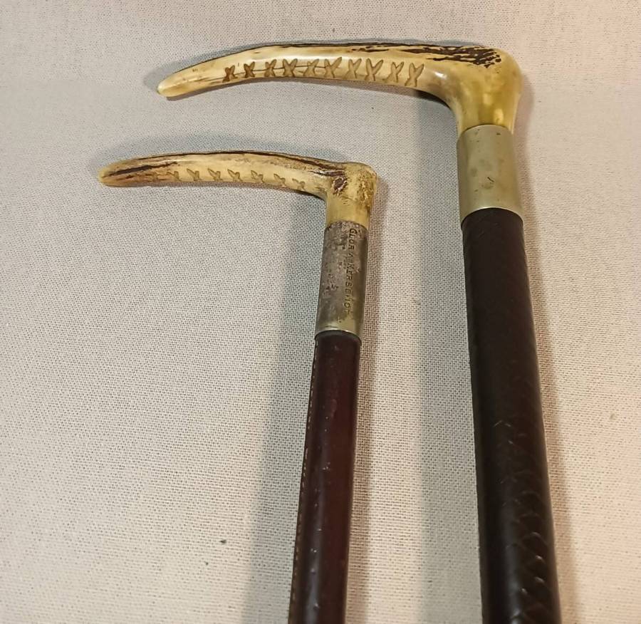 Two Antique Leather and Bone Handle Hunting Crops one with a Gloria Kerschot Silver Metal Collar