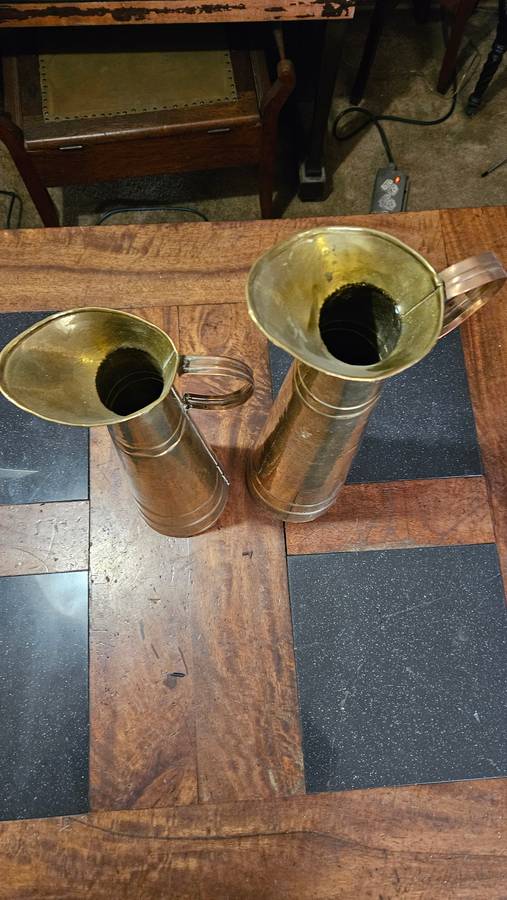 Two Tall Brass Pitchers