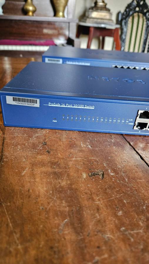 2 X NETGEAR Prosafe 16 Port 10/100 Switch. "Unused"
