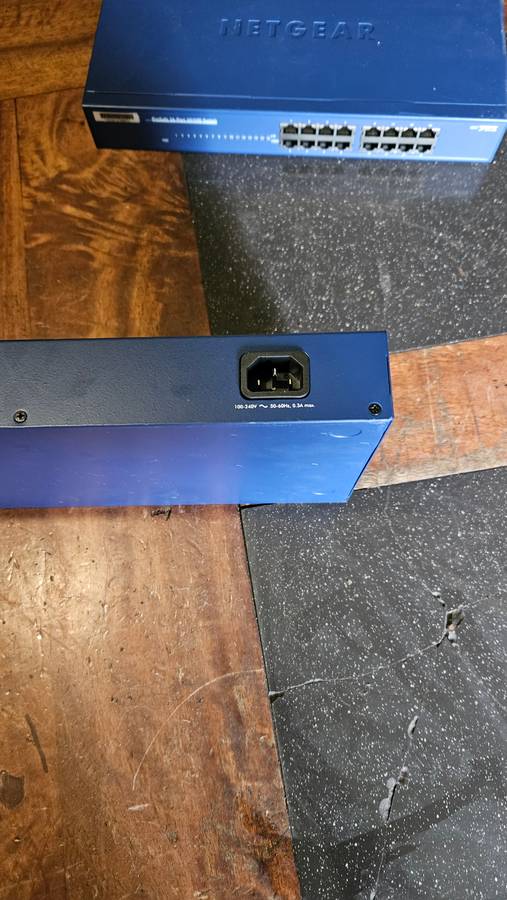 2 X NETGEAR Prosafe 16 Port 10/100 Switch. "Unused"