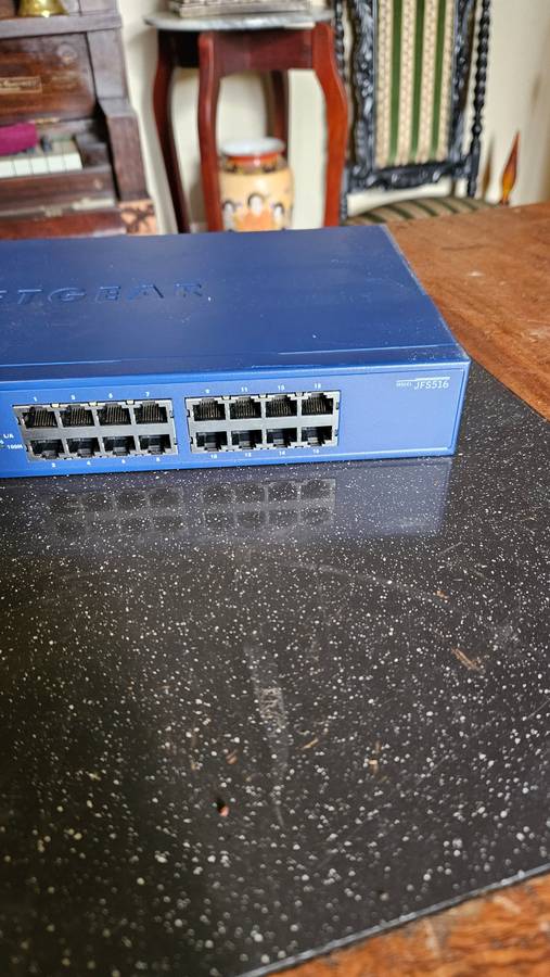2 X NETGEAR Prosafe 16 Port 10/100 Switch. "Unused"