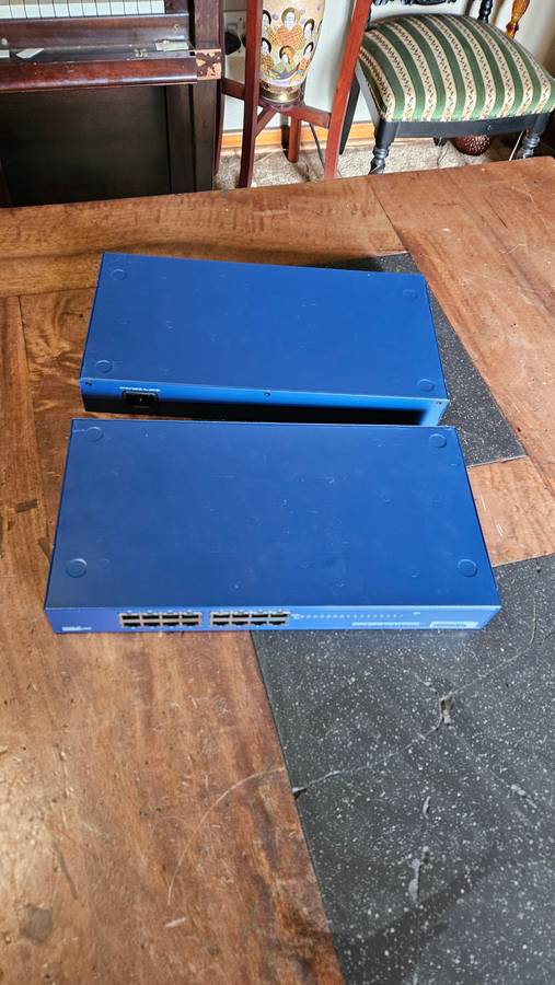 2 X NETGEAR Prosafe 16 Port 10/100 Switch. "Unused"
