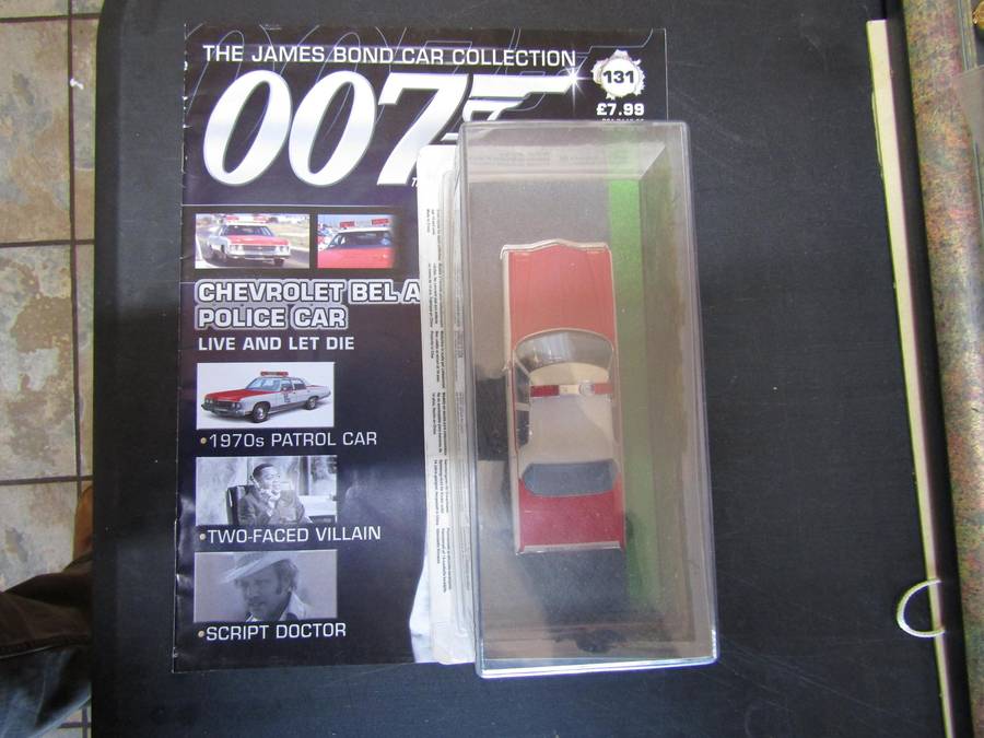 007 Chevrolet Bel Air Police Car - Live and let die - scale 1/43. Sealed. With Book Nr 131