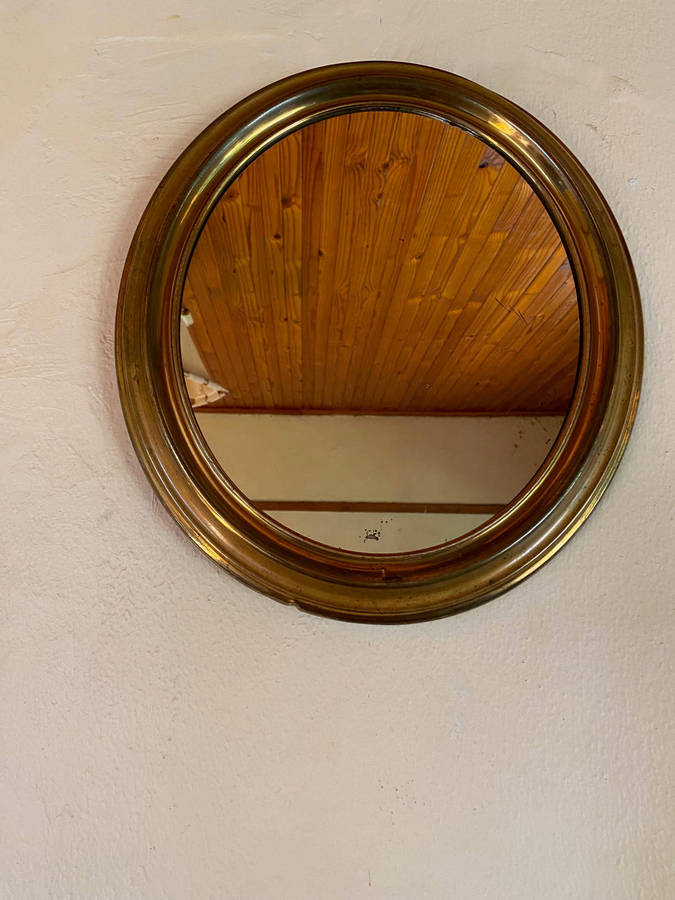 EDWARDIAN OVAL BRASS-FRAMED WALL MIRROR