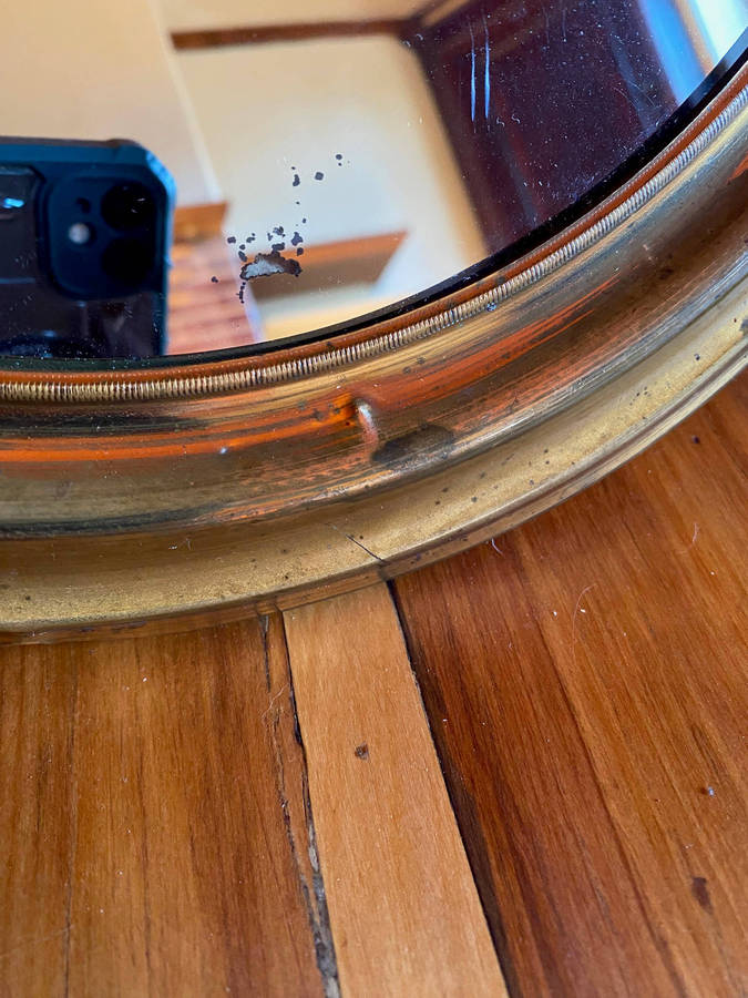 EDWARDIAN OVAL BRASS-FRAMED WALL MIRROR