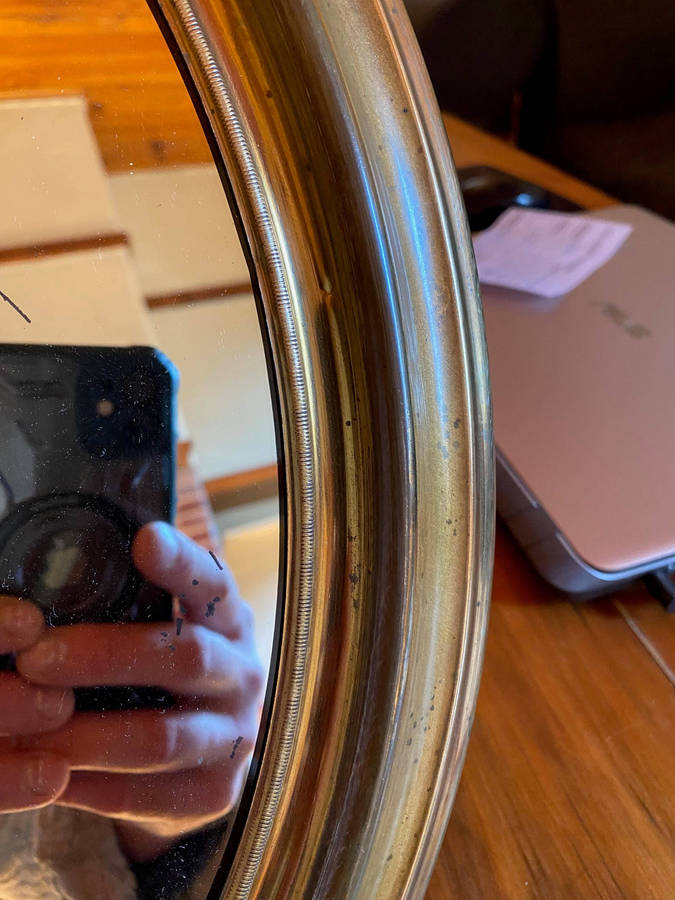 EDWARDIAN OVAL BRASS-FRAMED WALL MIRROR