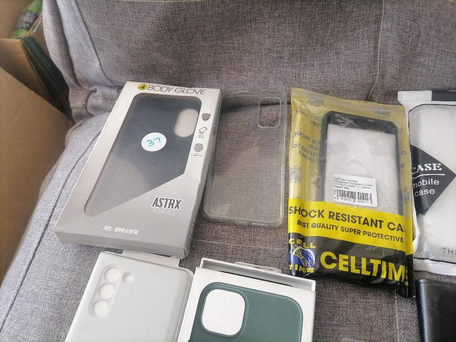 LOT OF APPLE PHONE, TABLET,NEW PHONE COVERS , ETC, ONE BID FOR THE LOT*