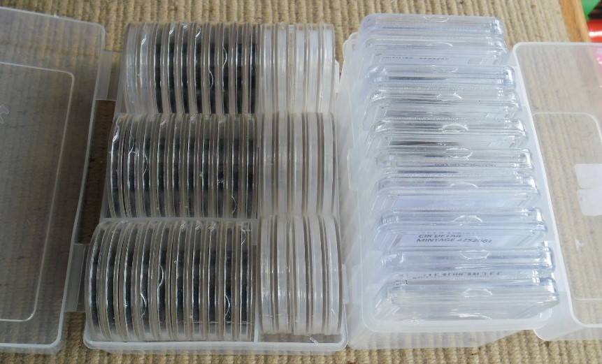 PLASTIC HOLDER WITH 45 COIN HOLDERS PLUAS BOX WITH 10 CLEAR SLABS USED CONDITION