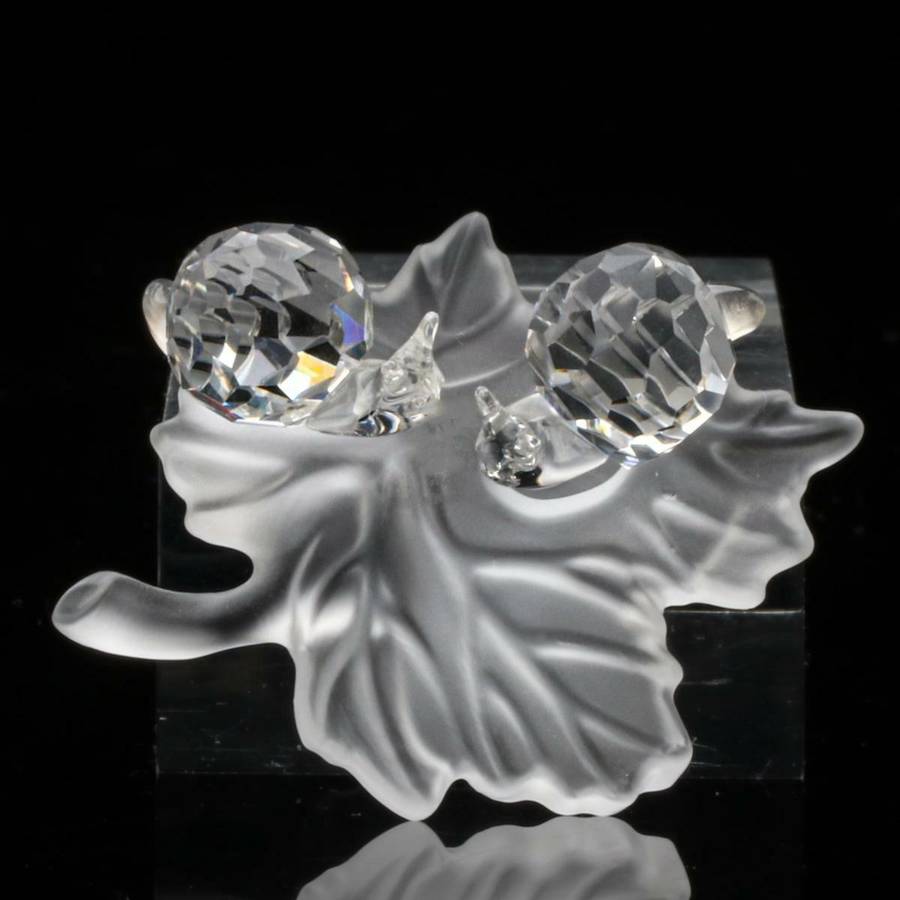 Swarovski Crystal Baby Snails on a Vine Leaf Among Flowers and Foliage
