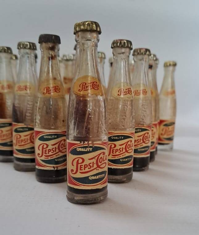 Pepsi miniature glass cold drink bottles x21 available. You bid on one only.