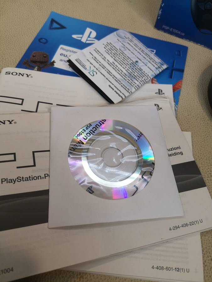 Sony psp sreet (Psp - E1004) charcoal black console with original packaging and games bundle
