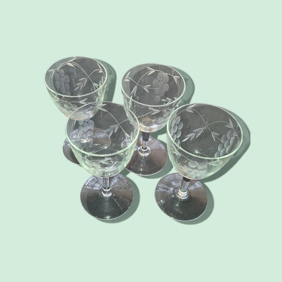 Sherry glasses with etched grapes motif