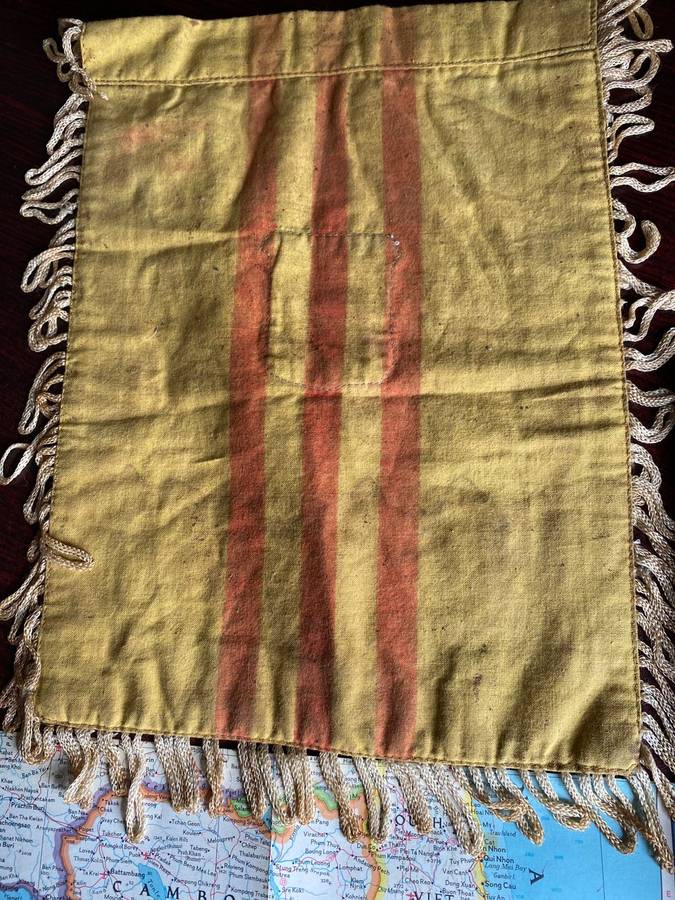 A BANNER WITH A WOVEN PATCH FOR THE VIETENAM WAR ARVN(ARMY OF THE REP. OF VIETNAM)AIR FORCE SURVEILL