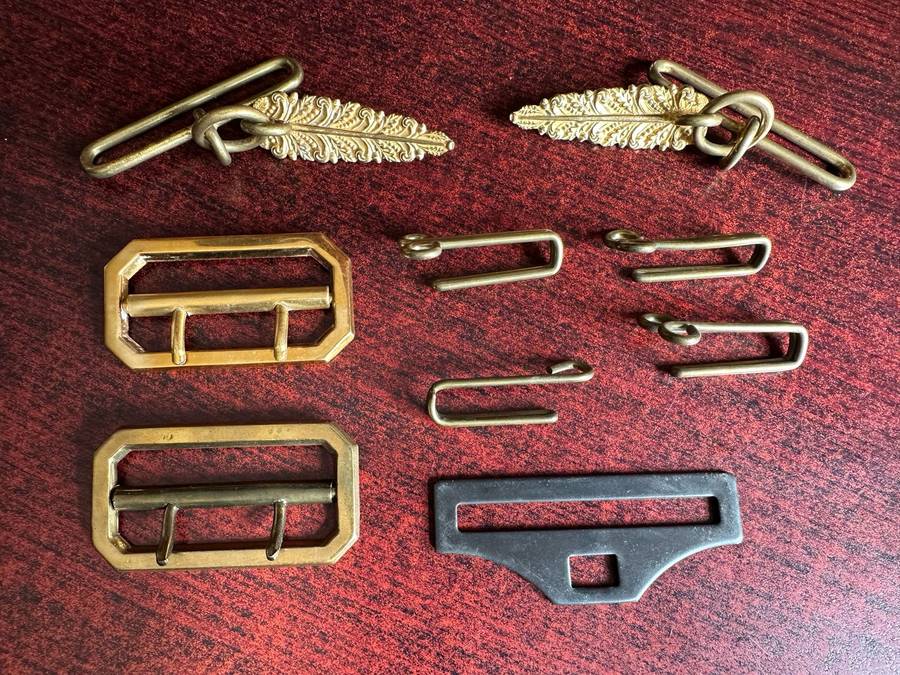 SELECTION OF BELT BUCKLES AND HANGERS-SOLD TOGETHER