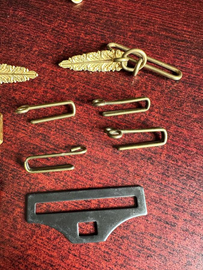 SELECTION OF BELT BUCKLES AND HANGERS-SOLD TOGETHER