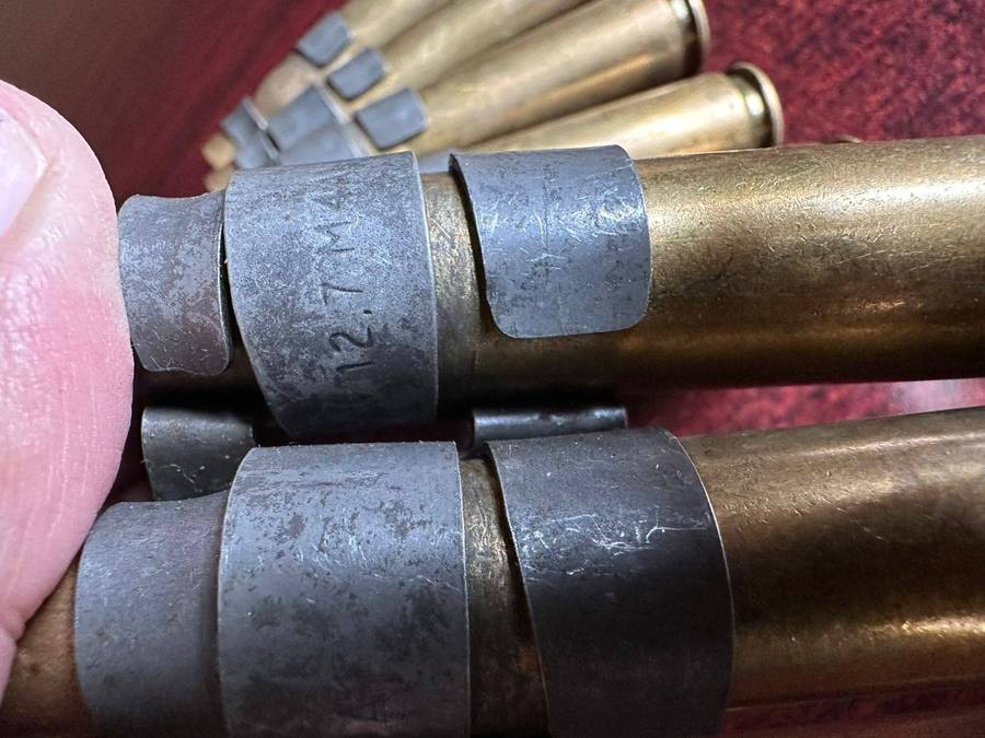 12,7 M4 machine gun belts. 2 Pieces with spent cartridges.