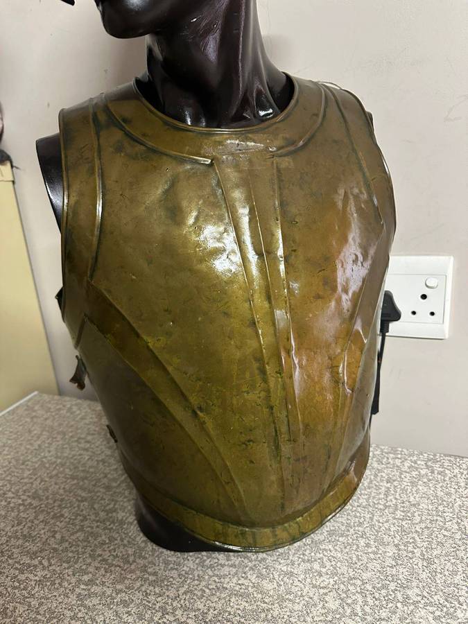 Reproduction Roman helmet and armour fitted onto a mannequin with a light inside the helmet. Sold as