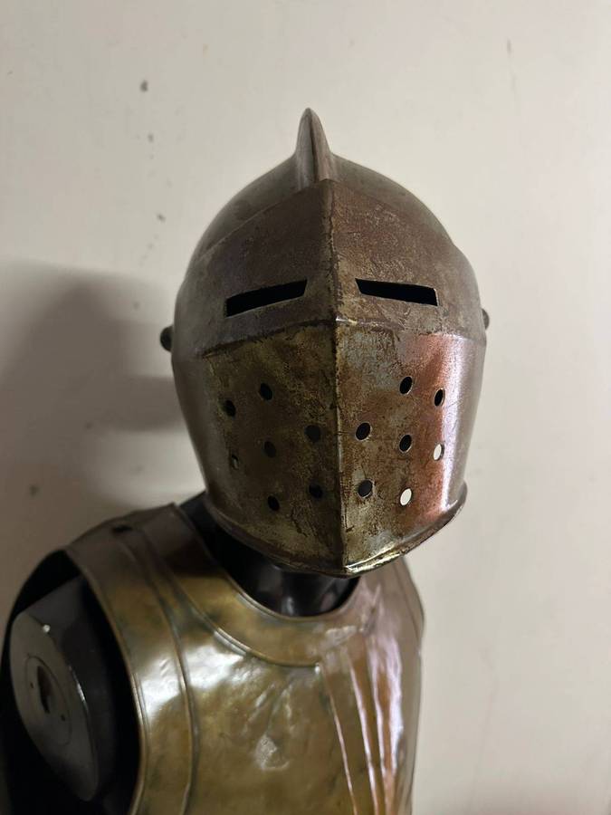 Reproduction Roman helmet and armour fitted onto a mannequin with a light inside the helmet. Sold as
