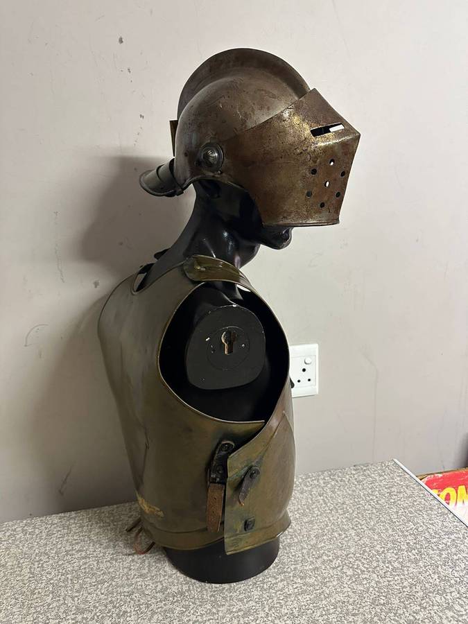 Reproduction Roman helmet and armour fitted onto a mannequin with a light inside the helmet. Sold as