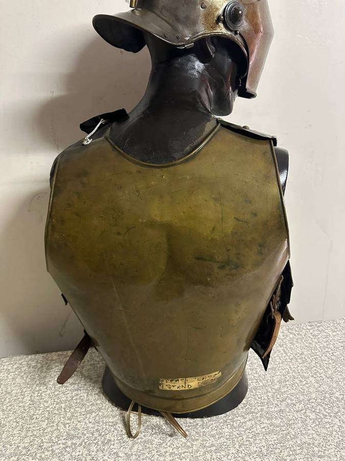 Reproduction Roman helmet and armour fitted onto a mannequin with a light inside the helmet. Sold as