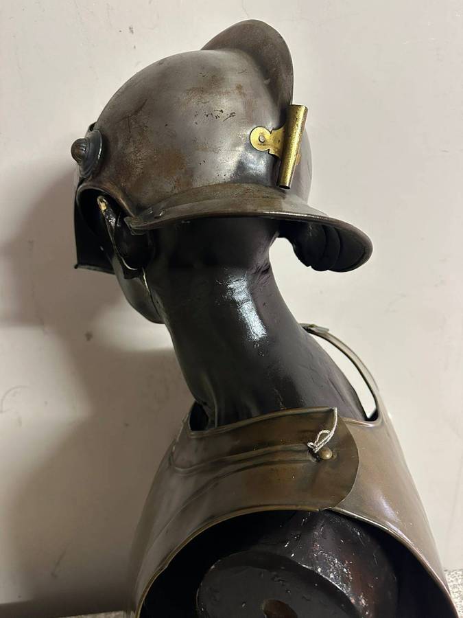 Reproduction Roman helmet and armour fitted onto a mannequin with a light inside the helmet. Sold as