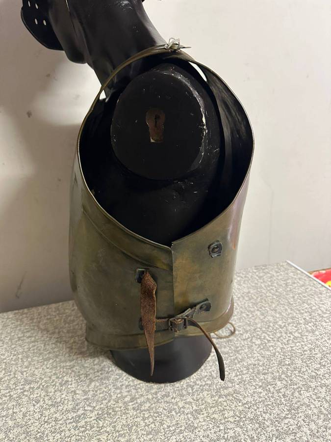 Reproduction Roman helmet and armour fitted onto a mannequin with a light inside the helmet. Sold as
