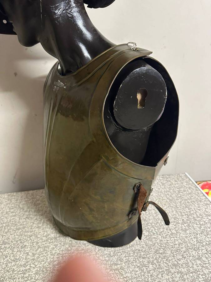 Reproduction Roman helmet and armour fitted onto a mannequin with a light inside the helmet. Sold as