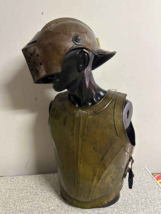 Reproduction Roman helmet and armour fitted onto a mannequin with a light inside the helmet. Sold as
