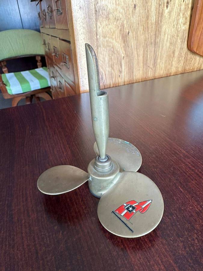 Brass propeller made into a pen holder. Diameter at the bottom 11,5cm, height 13 cm.