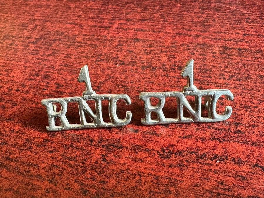 1 St. Regiment, Royal Natal Carbineers title pair. Worn 1936-1953. One lug damaged.