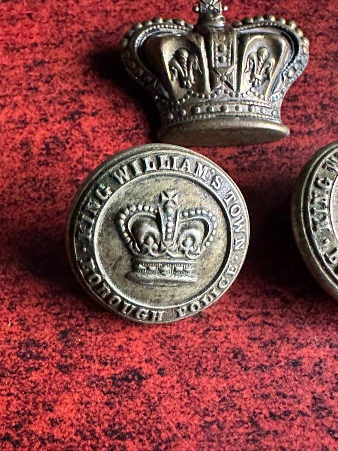King Williams Town borough police buttons and crown. Worn pre 1902(Queens Crown)white metal. Diamete