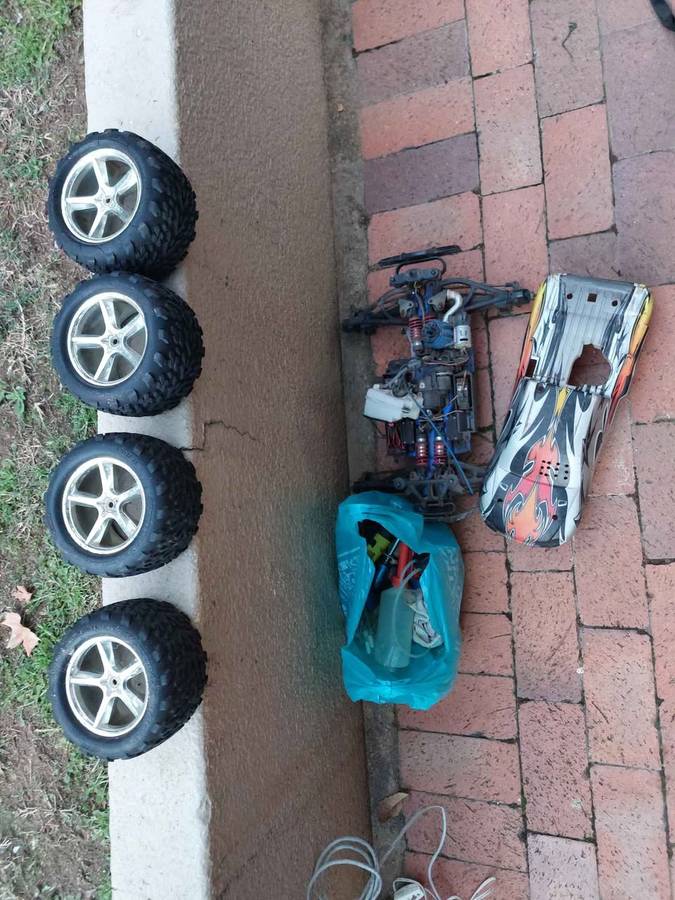 Radio Control car and 4 tyres for spares, and other accessories