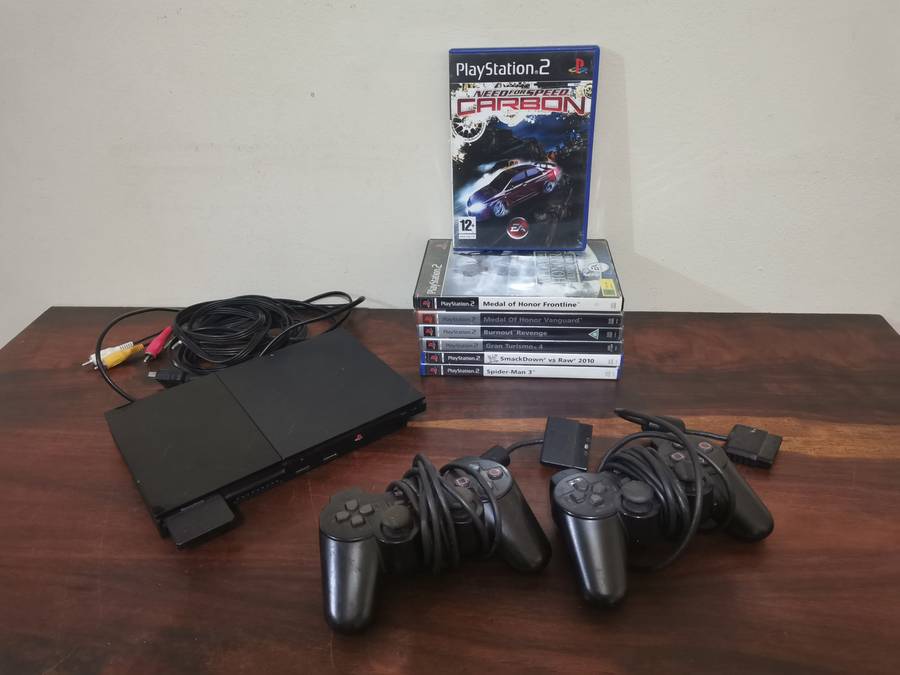 PlayStation 2 Console with Memory Card, Controllers and 7 Games